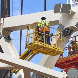 Workers on a construction site. Engineering and architectural infrastructure. Workplace